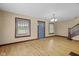 Living room featuring hardwood floors, neutral walls, and staircase at 113 N Munsie St, Indianapolis, IN 46229
