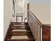 Wood staircase with decorative stair treads and wooden railings at 113 N Munsie St, Indianapolis, IN 46229