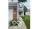 A charming home with a gray exterior and brick accents, complemented by a well-maintained walkway at 11532 Glenn Abbey Ln, Indianapolis, IN 46235