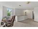 Spacious loft area with white walls, and large window at 11532 Glenn Abbey Ln, Indianapolis, IN 46235