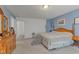 This is a spacious main bedroom with light-colored walls, carpet, and wooden furniture at 11532 Glenn Abbey Ln, Indianapolis, IN 46235
