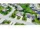Aerial view of well-maintained homes, green lawns, and mature trees in a suburban neighborhood at 1163 Meadowlark Dr, Greenwood, IN 46143