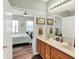 Bathroom view into bedroom featuring double vanity, natural lighting and neutral paint at 1163 Meadowlark Dr, Greenwood, IN 46143