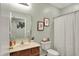 Bathroom features a vanity, a mirror, and a shower-tub combo at 1163 Meadowlark Dr, Greenwood, IN 46143