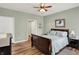 Comfortable bedroom with wood flooring, natural light, and classic furnishings at 1163 Meadowlark Dr, Greenwood, IN 46143