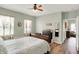 Bright bedroom featuring wood floors, neutral colors, and access to an adjacent room at 1163 Meadowlark Dr, Greenwood, IN 46143