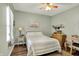 Cozy bedroom features wood floors, a ceiling fan and light green walls at 1163 Meadowlark Dr, Greenwood, IN 46143