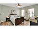 Cozy bedroom with wood flooring, soft lighting, and a comfortable queen-sized bed at 1163 Meadowlark Dr, Greenwood, IN 46143