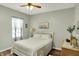 Bright bedroom with wood floors, a ceiling fan and light green walls at 1163 Meadowlark Dr, Greenwood, IN 46143