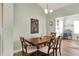Cozy dining room featuring hardwood floors, neutral paint and a wood dining table at 1163 Meadowlark Dr, Greenwood, IN 46143