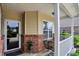 Inviting front porch detail with brick accents, neutral siding, and space for outdoor seating at 1163 Meadowlark Dr, Greenwood, IN 46143