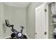 Hallway featuring neutral paint and an exercise bike next to a storage closet at 1163 Meadowlark Dr, Greenwood, IN 46143