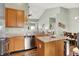 The kitchen has stainless steel appliances, granite countertops, wood cabinets, and an island at 1163 Meadowlark Dr, Greenwood, IN 46143