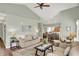 Spacious living room with neutral paint, wood flooring, and an open layout to the kitchen at 1163 Meadowlark Dr, Greenwood, IN 46143