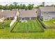 Aerial view of a spacious, fenced backyard with a patio, perfect for outdoor entertaining at 1181 S Aberdeen Dr, Franklin, IN 46131