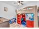 Playful bedroom with bed frame and toys, and a blue rug over wood-look flooring at 1181 S Aberdeen Dr, Franklin, IN 46131