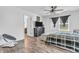 Bedroom features a ceiling fan, natural light from the window, and ensuite bathroom at 1181 S Aberdeen Dr, Franklin, IN 46131