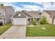 Charming single-Gathering home featuring a two-car garage, well-manicured lawn, and inviting curb appeal at 1181 S Aberdeen Dr, Franklin, IN 46131