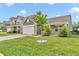 Beautiful single-Gathering home with a well-manicured lawn and a two-car garage on a sunny day at 1181 S Aberdeen Dr, Franklin, IN 46131