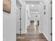 Hallway featuring wood-look floors with views to other rooms and an abundance of natural light at 1181 S Aberdeen Dr, Franklin, IN 46131