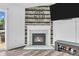Close up of fireplace with wooden mantle and wooden accent wall in the living room at 1181 S Aberdeen Dr, Franklin, IN 46131
