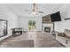 Open concept living room featuring a fireplace and sliding glass doors to the backyard at 1181 S Aberdeen Dr, Franklin, IN 46131