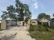 Backyard of home showing an empty garage and other yard debris at 1214 Wallace Ave, Indianapolis, IN 46201