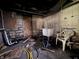 A basement area featuring concrete walls, pipes, laundry sink and room for customization at 1214 Wallace Ave, Indianapolis, IN 46201