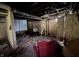 A basement area featuring concrete walls, pipes, and room for customization at 1214 Wallace Ave, Indianapolis, IN 46201