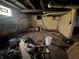 A basement area featuring natural light, concrete walls, pipes, and room for customization at 1214 Wallace Ave, Indianapolis, IN 46201