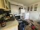 Interior kitchen view showing significant damage and debris at 1214 Wallace Ave, Indianapolis, IN 46201