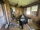 Spacious living room area, featuring wood paneling and lots of natural light at 1214 Wallace Ave, Indianapolis, IN 46201