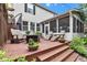 Multi-level deck with seating, screened porch, and garden views at 12234 Limestone Dr, Fishers, IN 46037