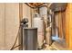 Unfinished basement featuring a water heater, water softener, and furnace at 12234 Limestone Dr, Fishers, IN 46037