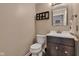 Small half-bath with updated vanity and decor at 12234 Limestone Dr, Fishers, IN 46037