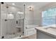 Bathroom with a glass shower, garden tub, and marble countertops at 12234 Limestone Dr, Fishers, IN 46037