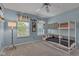 Cozy bedroom with blue walls, a bunk bed, and natural light from the windows at 12234 Limestone Dr, Fishers, IN 46037