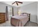 Inviting bedroom featuring neutral walls, a comfy bed, and a dresser at 12234 Limestone Dr, Fishers, IN 46037