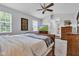 Bedroom featuring a queen-size bed and an ensuite bathroom at 12234 Limestone Dr, Fishers, IN 46037