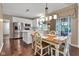Eat-in kitchen opens to dining area and kitchen with breakfast table and chairs at 12234 Limestone Dr, Fishers, IN 46037