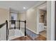 Upstairs hallway with hardwood floors connecting to bedroom and bath at 12234 Limestone Dr, Fishers, IN 46037