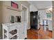 Kitchen offers a stainless steel fridge, island, and white cabinets at 12234 Limestone Dr, Fishers, IN 46037