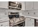 Kitchen features stainless steel appliances and white subway tile backsplash at 12234 Limestone Dr, Fishers, IN 46037
