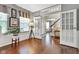 Cozy office showcasing hardwood floors, large windows, and elegant French doors at 12234 Limestone Dr, Fishers, IN 46037