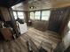 Shows a laundry area with a washer, dated cabinets and poor lighting at 1226 Hiatt St, Indianapolis, IN 46221
