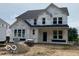 New two-story home featuring a modern architectural style and bright, plentiful windows at 12592 Lowery Way, Fishers, IN 46037