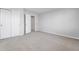 Bright bedroom features neutral carpeting, gray walls, closet and doors at 1328 Plover Dr, Greenwood, IN 46143
