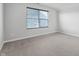 Bedroom features neutral carpeting, gray walls, and a window with blinds at 1328 Plover Dr, Greenwood, IN 46143