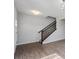 Welcoming entryway with wood-look flooring and a classic staircase leading to the upper level at 1328 Plover Dr, Greenwood, IN 46143