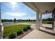 Covered porch with stone columns offering a view of the neighborhood lake at 1328 Plover Dr, Greenwood, IN 46143